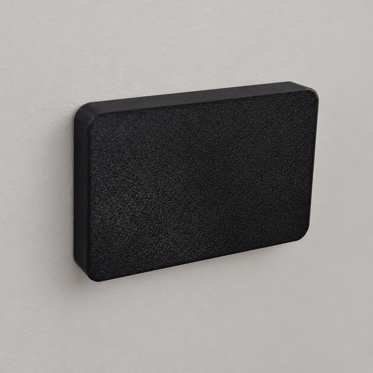 AI-retouched photograph of the black 3D printed socket cover